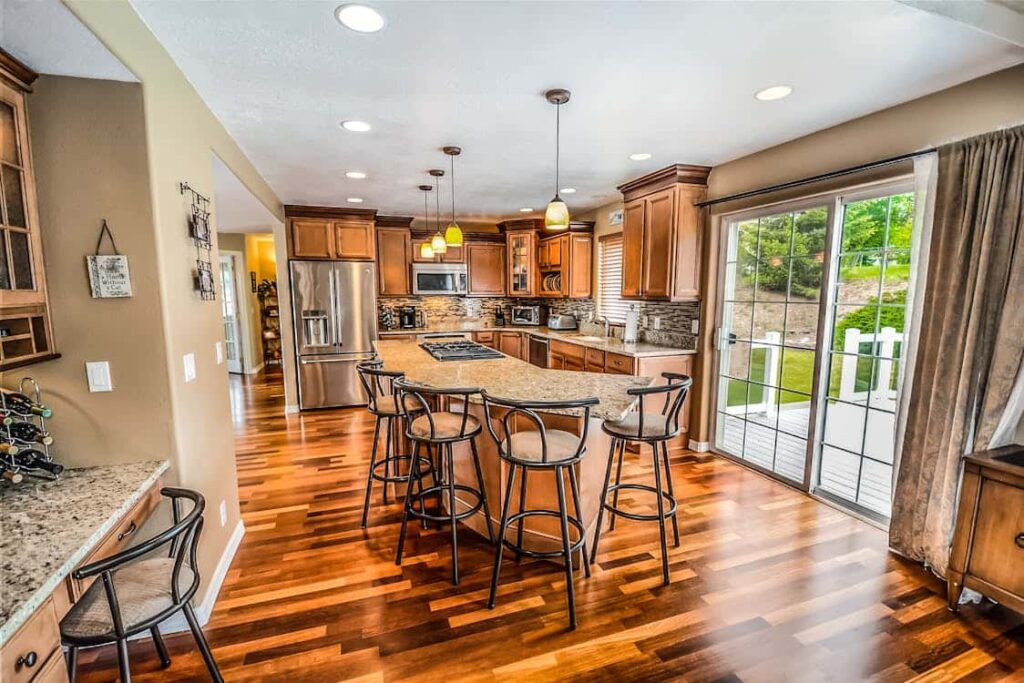 House Cleaning Services offered for kitchen with wooden floors.